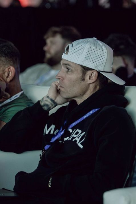 Attendee listening closely during a session
